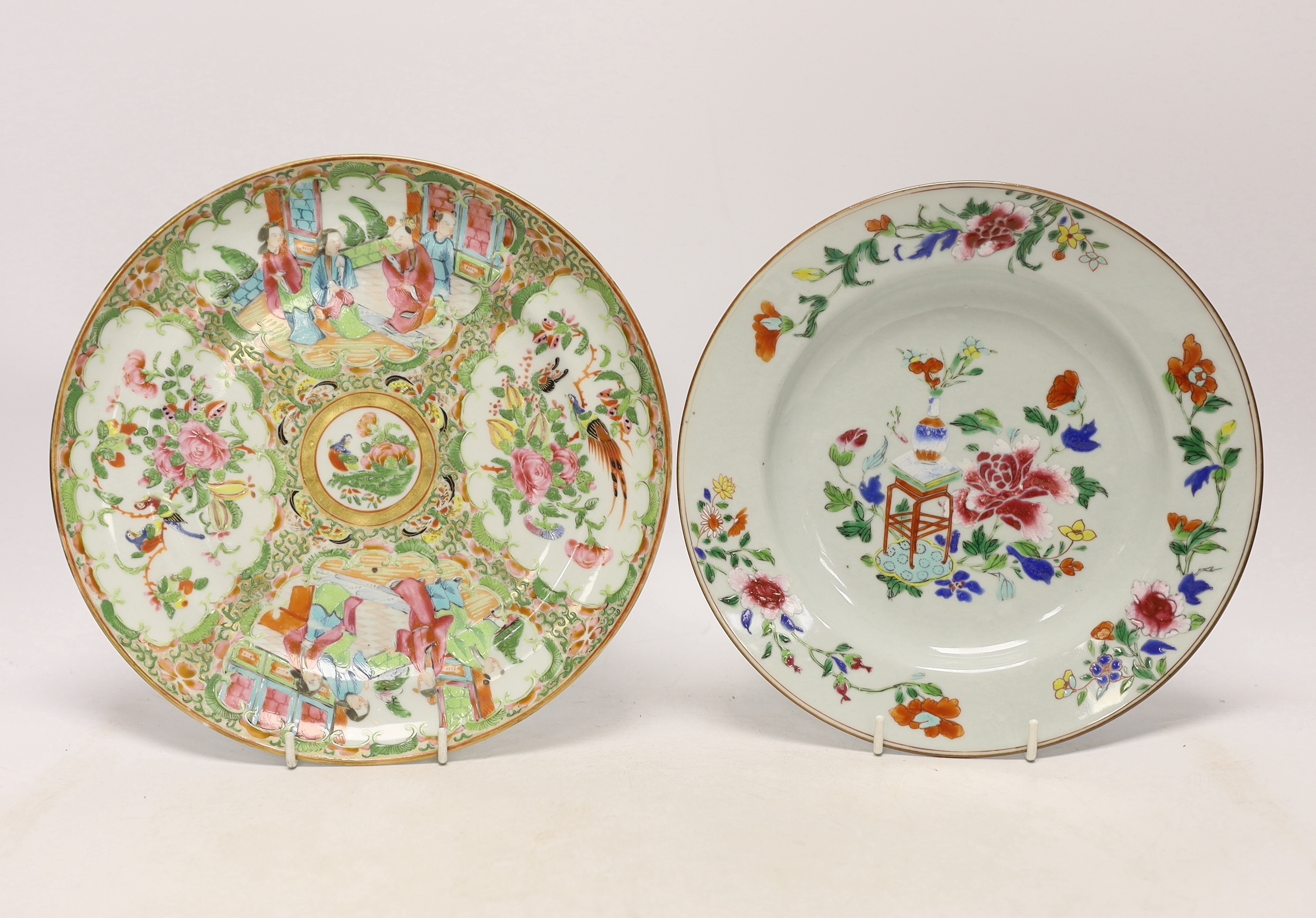 A late 18th century Chinese famille rose plate and a 19th century famille rose plate, largest 24.5cm in diameter